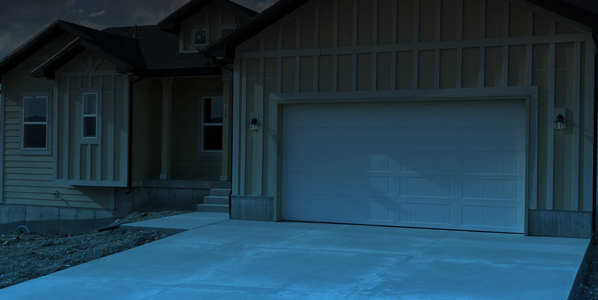 garage door of a tan house